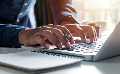 TechHire IT Training, a man at a keyboard TechHire IT Training, a man at a keyboard