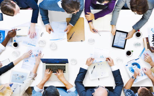 a group of professionals at a meeting