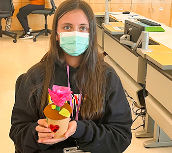 Teen with her mechanical color changing flower